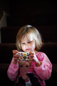 young girl looking at a cell phone screen