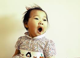 little girl yawning