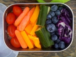 container of colorful fruits and vegetables
